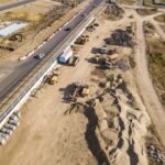 Motor grader with FJD guidance on road subgrade